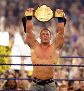 john-cena-showing-his-belt-in-ring-pictures